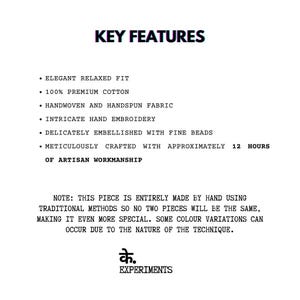 May include: Text graphic with the words "KEY FEATURES" at the top. Bullet points describe the product's features: elegant relaxed fit, 100% premium cotton, handwoven fabric, hand embroidery, fine beads, and artisan craftsmanship. The text also notes that each piece is handmade.
