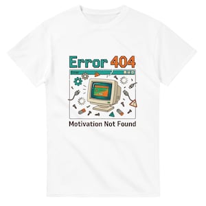 May include: White t-shirt with a retro computer graphic. The design features the text "Error 404" in teal and orange, and "Motivation Not Found" in black. The graphic includes a vintage computer monitor, cables, and other tech elements.
