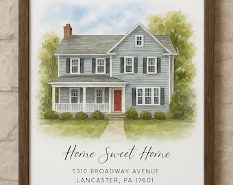 May include: Watercolor painting of a two-story house with a red door, framed in a dark wood. The text "Home Sweet Home" and address are below the house. The house is light blue with black shutters.