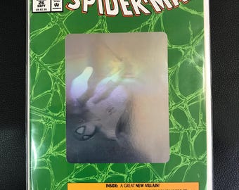 May include: A Spider-Man comic book, a 30th Anniversary Special, with a green background and the title in large white letters. The cover features a holographic image of Spider-Man. Text includes "Marvel Comics" and "Giant-Sized".