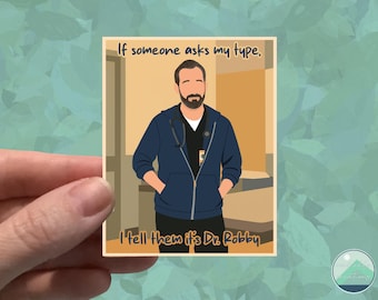 May include: A sticker featuring an illustration of a man in a blue hoodie and scrubs, with a stethoscope around his neck. The text reads, "If someone asks my type, I tell them it's Dr. Robby."