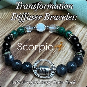 May include: A beaded bracelet with the text "Transformation Diffuser Bracelet: Scorpio with Aromatherapy Lava Rock." The bracelet features black, green, and clear beads, with a silver-toned charm displaying the Scorpio symbol.