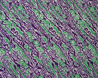 May include: Abstract pattern fabric with a white background and green and purple wavy lines.