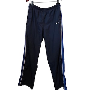 nike track pants white stripe