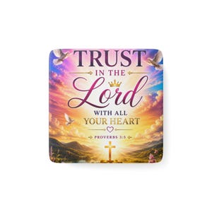 May include: A square coaster featuring a sunset landscape with mountains and a cross. The text reads: TRUST IN THE LORD WITH ALL YOUR HEART PROVERBS 3:5. Two white doves fly in the sky, which is filled with pink, orange, and yellow clouds.