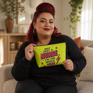 May include: A lime green zippered pouch featuring the black and pink text "NOT JUST A NURSE I'M THE WHOLE VIBE" with graphic star and lightning bolt accents. The pouch has a rectangular shape with rounded corners and a black zipper closure at the top.