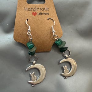 Handmade Cat on Crescent Moon Earrings with Green Gemstone Accents | Witchy Celestial Jewelry | Gift for Cat Lovers