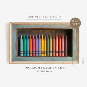 May include: A rectangular wall art piece featuring a row of colorful crayons inside a distressed teal and gold frame. Text reads HUE NEST ART STUDIO, BUY 1 GET 2, and PREMIUM FRAME TV ART FITS UP TO 85 INCHES. The crayons display a full spectrum of colors.