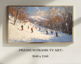 May include: A framed digital artwork displaying a snowy mountain landscape with skiers descending a slope among bare trees. The scene features bright white snow, blue sky, and orange-clad figures. Text below reads: -PREMIUM FRAME TV ART- 3840 x 2160.