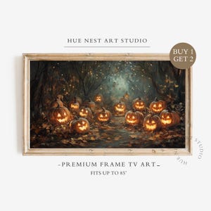 May include: A rectangular framed digital art piece for a television screen featuring a dark forest scene with numerous glowing jack-o'-lanterns on the ground. The text HUE NEST ART STUDIO, BUY 1 GET 2, and PREMIUM FRAME TV ART FITS UP TO 85" are visible.