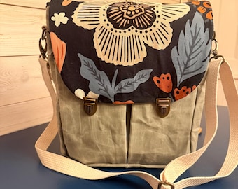 Messenger Bag with top flap closure. Beautiful waxed canvas with floral accent fabric.
