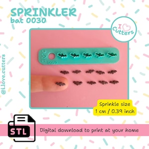 May include: A teal plastic bat-shaped sprinkle cutter and several brown bat sprinkles are displayed on a pink surface. The text "SPRINKLER bat 0030" is at the top. The sprinkle size is 0.39 inch. The image also includes the text "Digital download to print at your home."
