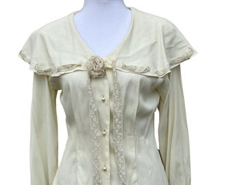 Lovely cream 70’s Victorian style button up blouse.