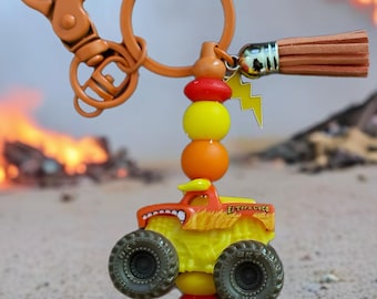 El Toro Loco Monster Truck Keychain – Orange/Yellow Beads + Tassel + Lightning Charm