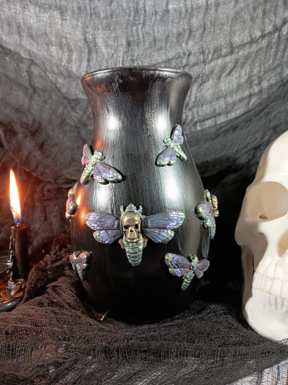 Hand-crafted black glass vase adorned with death's-head moth motifs — a striking piece of dark home decor that feels straight out of a Victorian curiosity cabinet.