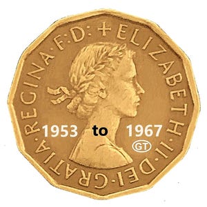 May include: A gold-colored coin with an octagonal shape. The coin features a profile of a woman and the text "REGINA F.D. + ELIZABETH II D. GRATIA" around the edge. The years "1953 to 1967" are also visible.