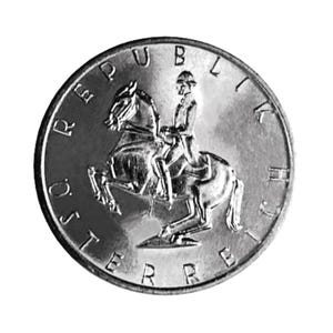 May include: A silver coin featuring a rider on horseback, with the words "REPUBLIK ÖSTERREICH" around the edge. The coin has a detailed design and a reflective surface, with the rider and horse in the center.