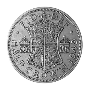 May include: A silver Half Crown coin from 1949. The coin features a detailed design with text including "FID DEF" and "HALF CROWN". The coin has a detailed coat of arms and two crowns on either side of the coin.
