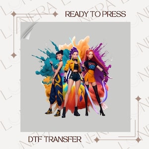 May include: DTF transfer featuring three stylized female figures with vibrant hair and clothing, set against a colorful splash background. The text "READY TO PRESS" and "DTF TRANSFER" are visible.