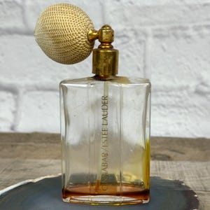 May include: A set of three ceramic mugs with a speckled, matte finish. The mugs are in shades of cream, light gray, and dark gray. Each mug has a simple, minimalist design and a rounded handle.