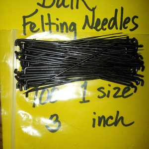 May include: A clear plastic bag filled with 100 black felting needles, all 1 inch in size. The bag is on a yellow background with the text "Bulk Felting Needles" and "1 size 3 inch" written in black.