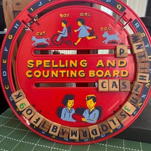 Vintage 1950s plastic spelling toy