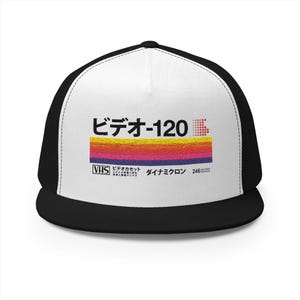 May include: Black and white trucker hat with a white front panel. The front features Japanese text and a colourful retro design reminiscent of a VHS tape label. The hat has a curved brim and mesh back.