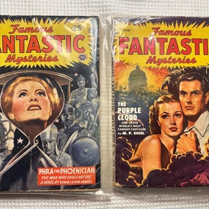 May include: Two vintage "Famous Fantastic Mysteries" magazines. The September issue features a woman in a space helmet, the text "Phra the Phoenician". The June issue features a couple with the text "The Purple Cloud". Both are 25 cents.