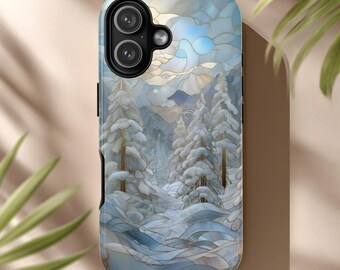 May include: A smartphone case featuring a winter landscape design. The case depicts snow-covered pine trees, mountains, and a blue sky with a stained-glass effect. The case is primarily blue, white, and gold.