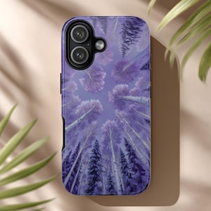 May include: A purple phone case featuring a forest scene with tall trees reaching towards the sky. The case has a black border and a camera cutout. The design includes various shades of purple and white, creating a dreamy, artistic aesthetic.