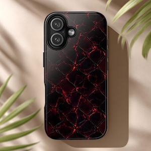 May include: A smartphone case with a dark red and black textured pattern. The case has a glossy finish and a camera cutout. The design resembles a reptile skin. The case is designed to fit a smartphone.