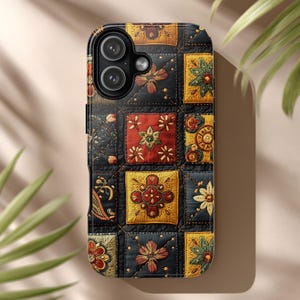 May include: A decorative phone case featuring a patchwork design with embroidered floral patterns in red, yellow, and green on a black background. The case has a glossy finish and a camera cutout.