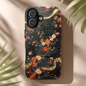 May include: A black phone case with a floral design. The case features a dark teal background with orange and cream-colored flowers and gold accents. The design is an artistic representation of a floral pattern.