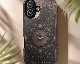 May include: Black phone case with a celestial design featuring stars, moons, and a bat silhouette. The case has a dark background with bronze-colored accents and a glossy finish. The design includes a sunburst pattern and intricate details.
