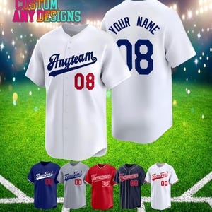May include: White baseball jersey with "Anyteam" in navy blue script and the number "08" in red. The back of the jersey has "YOUR NAME" and the number "18" in navy blue. Additional jerseys in various colours are displayed below.
