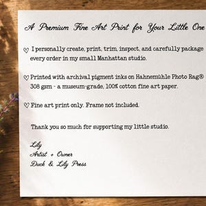 May include: A square white card with black text reading A Premium Fine Art Print for Your Little One, detailing production in a Manhattan studio, use of archival pigment inks on 308 gsm cotton paper, and noting the frame is not included.