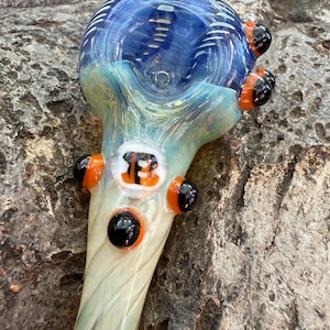 Decorated blue and orange striped B glass pipe.  Fumed with silver and gold. Made in USA