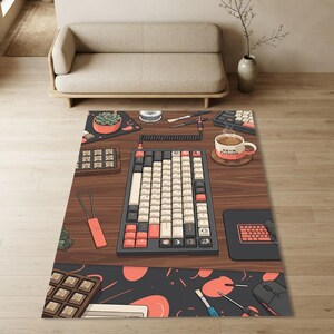 May include: A rectangular area rug featuring a detailed illustration of a wooden desk setup. The design includes a mechanical keyboard, a coffee mug labeled Keyb Fusion, a succulent, a mouse, and various small tools on a dark patterned mat.