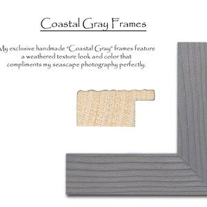 May include: A close-up of a gray wood picture frame with a weathered texture. The frame is made of wood and has a light gray finish. The frame is shown in a corner view.