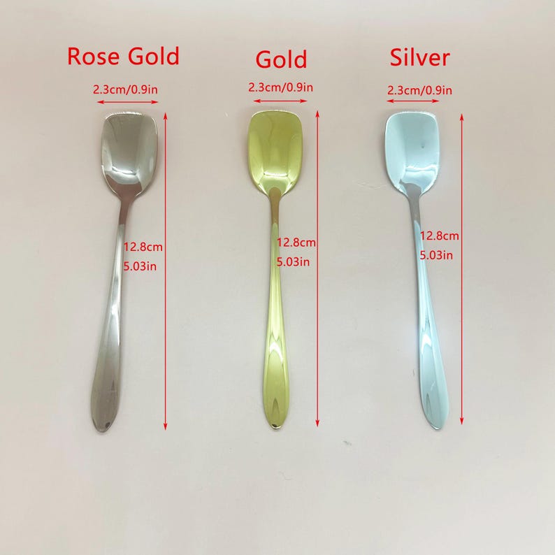 May include: Three spoons in rose gold, gold, and silver. Each spoon has a rectangular head, measuring 0.9 inches wide, and a slender handle. The spoons are 5.03 inches long. The text "Rose Gold", "Gold", and "Silver" is above each spoon.