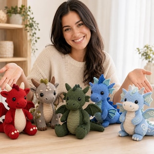 May include: Five knitted dragon plush toys in red, grey, dark green, blue, and light blue. Each dragon features a cream-colored belly, small horns, wings, and embroidered eyes. The toys are arranged in a row, showcasing different colors and textures.