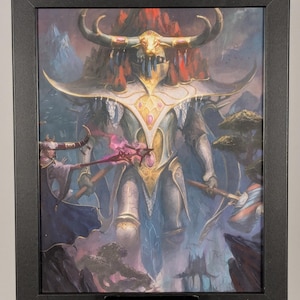 May include: Framed fantasy art print featuring a towering armored figure with large horns and ornate gold accents. The artwork depicts a battle scene with other figures and a mountainous background, all within a black frame.