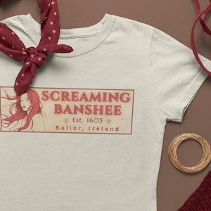 Maglietta Screaming Banshee Inn: pub irlandese ispirato a Nancy Drew