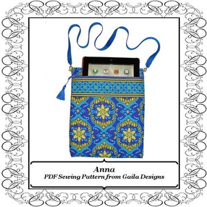 May include: A PDF sewing pattern for a blue and yellow tablet case with a blue strap. The pattern is called "Anna" and is from Gaile Designs.