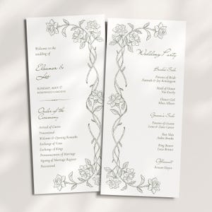 Peut inclure: Deux cartes de programme de mariage blanches avec des illustrations au trait noir de vignes fleuries grimpantes. La carte de gauche affiche les noms Eleanor & Leo, la date et le déroulement de la cérémonie. La carte de droite liste les membres du cortège.