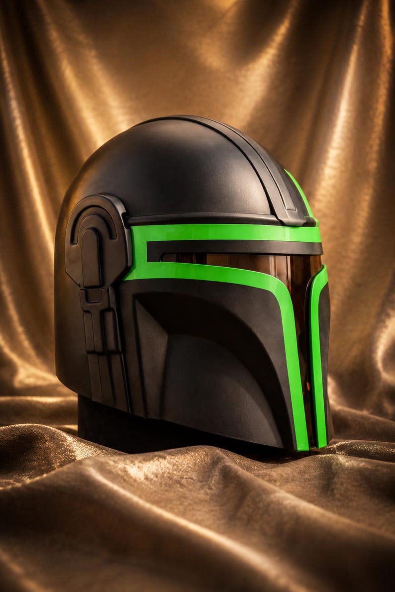 May include: A matte black helmet featuring a T-shaped visor opening accented with vibrant neon green trim. The helmet includes a dark, semi-transparent brown face shield and a mechanical side detail on the right temple area of the headgear.
