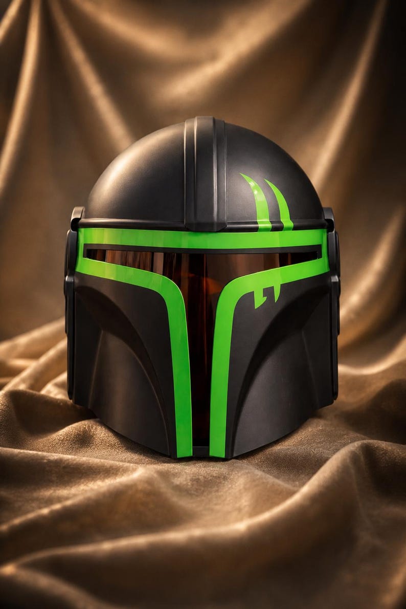 May include: A matte black helmet featuring a T-shaped visor opening outlined in vibrant neon green. The helmet includes a dark, reflective brown face shield and two curved neon green accent marks on the upper right side of the dome.