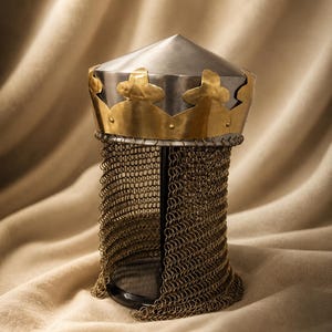 May include: A conical steel helmet featuring a decorative brass crown band with scalloped edges. Attached to the base of the helmet is a long, flexible brass chainmail aventail that hangs down, composed of numerous small interlocking metal rings.