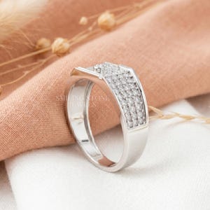 F Color VS Lab Diamond symmetry and facets on a Platinum band. High-quality craftsmanship showing 4 rows of pave stones. Elite luxury look for custom bridal jewelry.