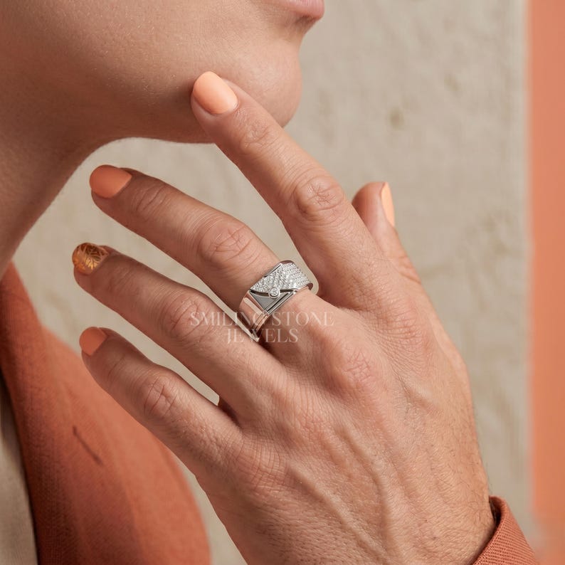 Wedding Band for grooms in 14k Gold. Bridal Jewelry for modern ceremonies. Engagement Ring featuring a unique geometric wrap design with hand-set stones.